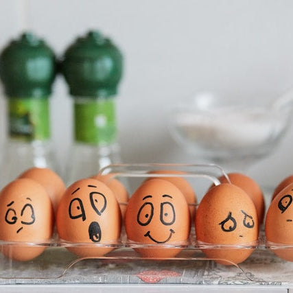 Eggs with different faces painted on them